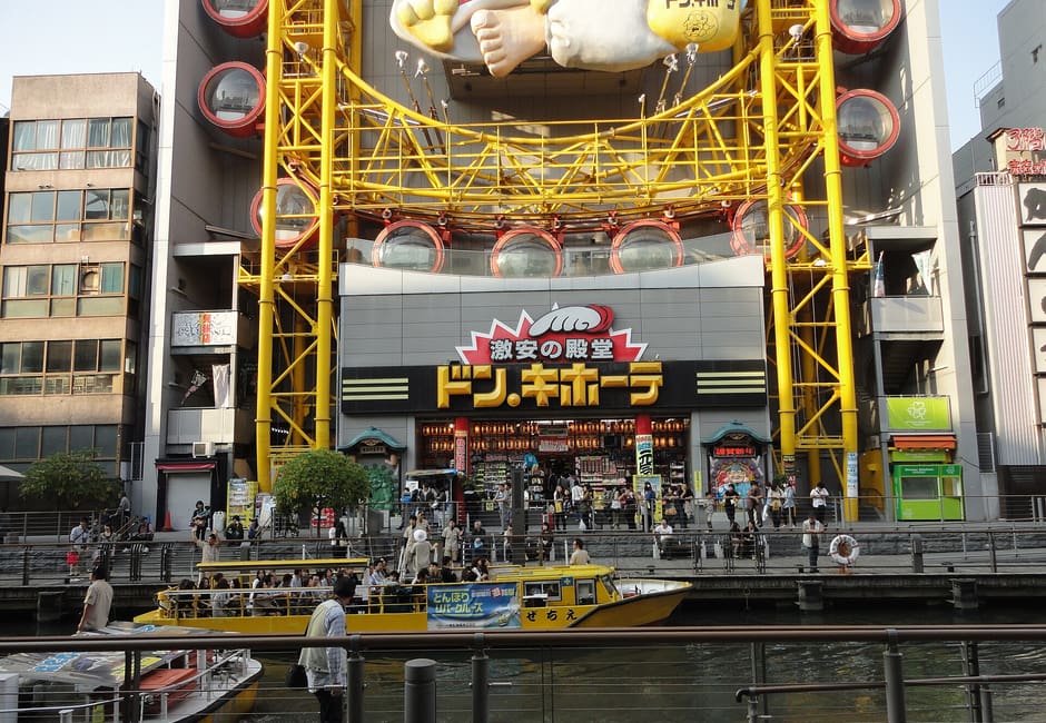 Dotonbori Ferris wheel above the Don Quijote store beside the Dotonbori canal in Osaka