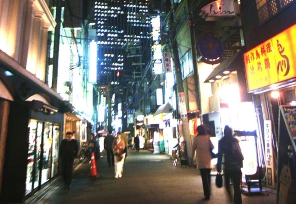 Kitashinchi street at night with shop signs in Osaka