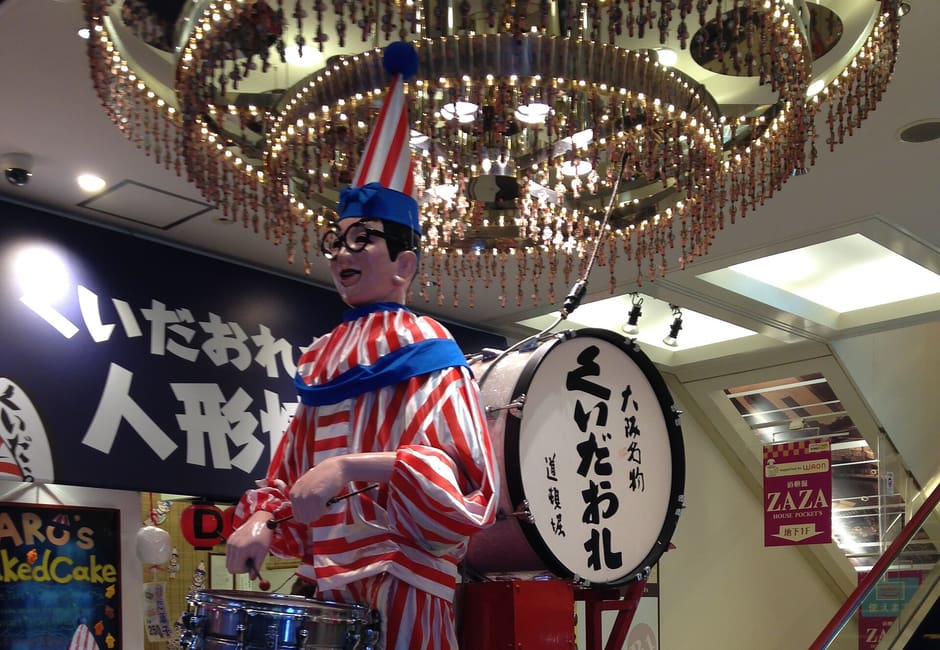 Kuidaore Taro clown mascot statue inside the Nakaza Cuidaore Building in Dotonbori, Osaka