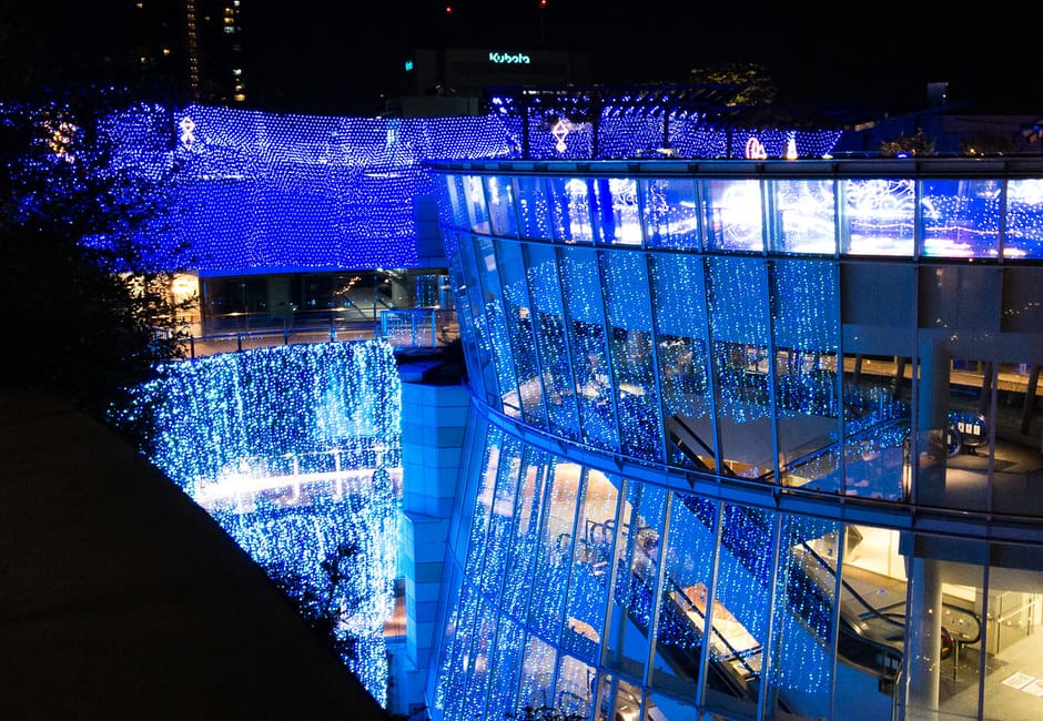 Terraced Namba Parks complex lit with blue winter illuminations in Osaka