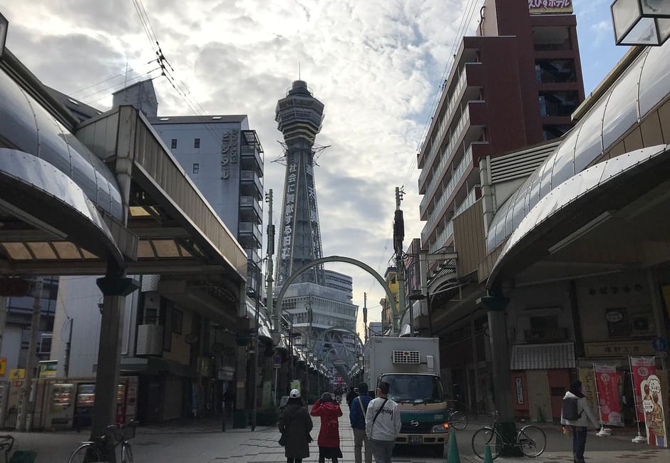 Tsutenkaku Tower rising above Tsutenkaku Hondori shopping street in Shinsekai, Osaka