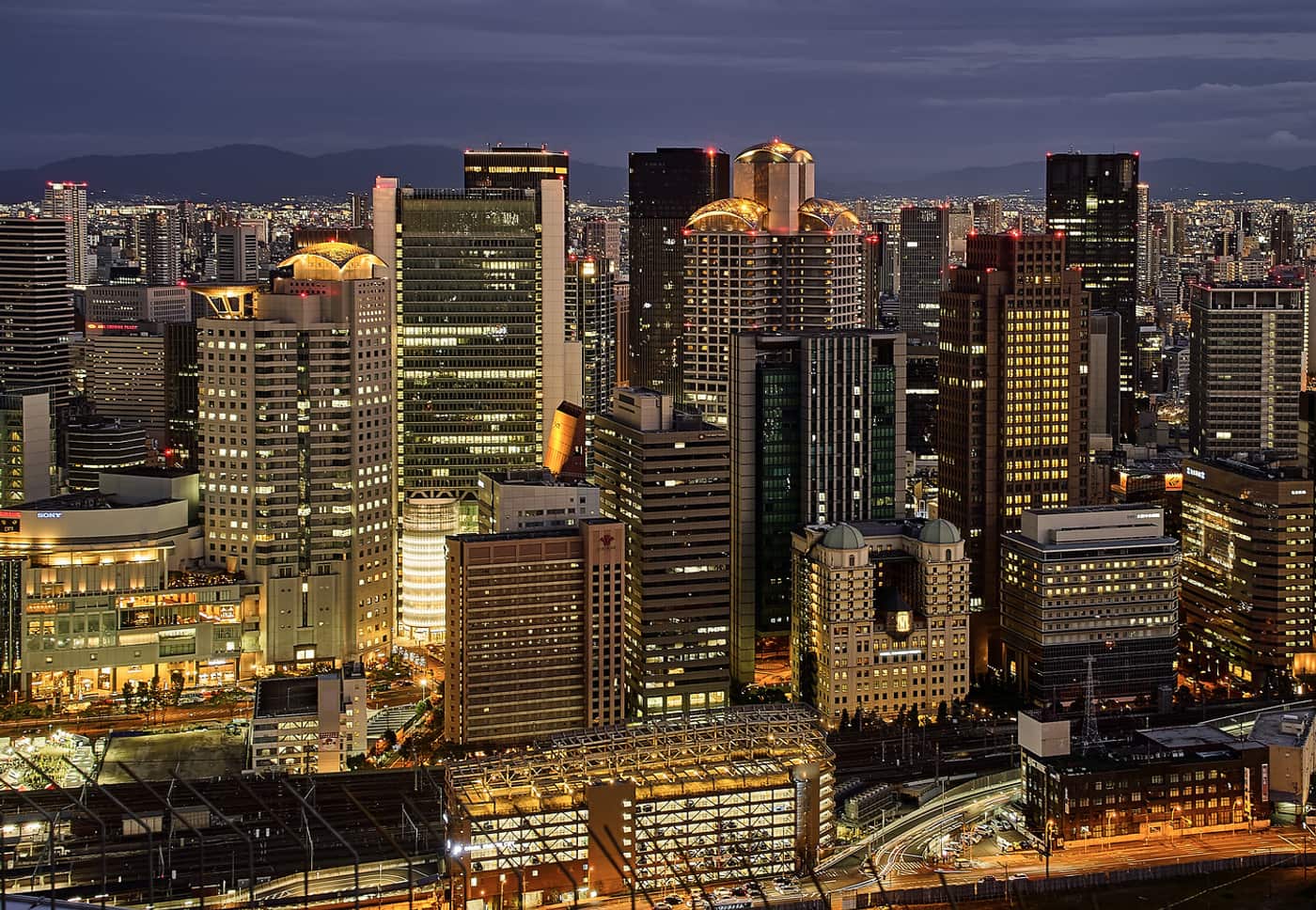 Night view of the Umeda skyscrapers and rail lines in Osaka